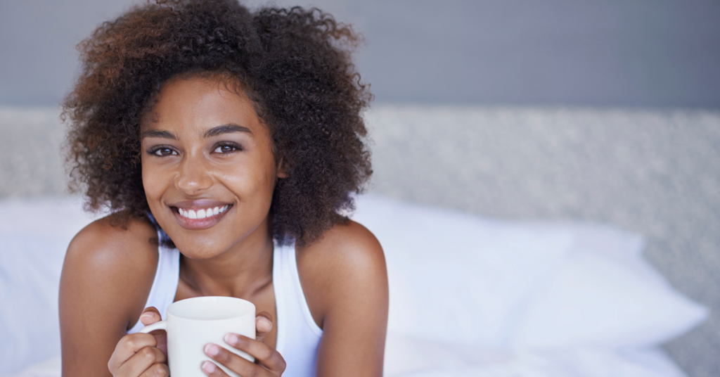 woman holding coffee cup