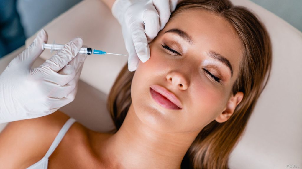 Woman receiving injectable treatment (model)